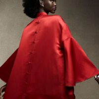 Adut akech wearing red outfit