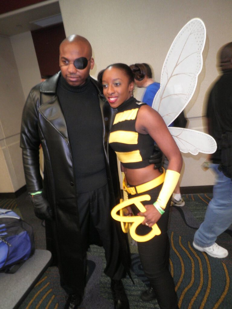 Black guy as nick fury and black girl as bumble bee