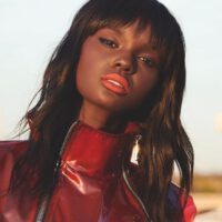 Duckie thot wearing red jacket