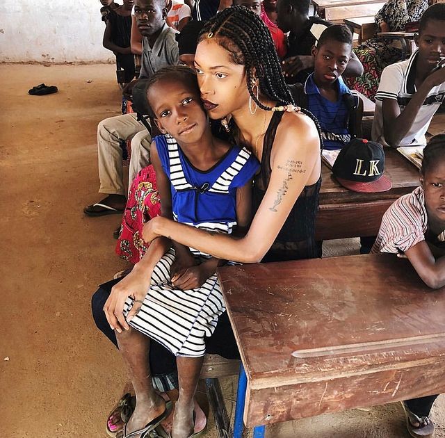 Jessica white holding black child