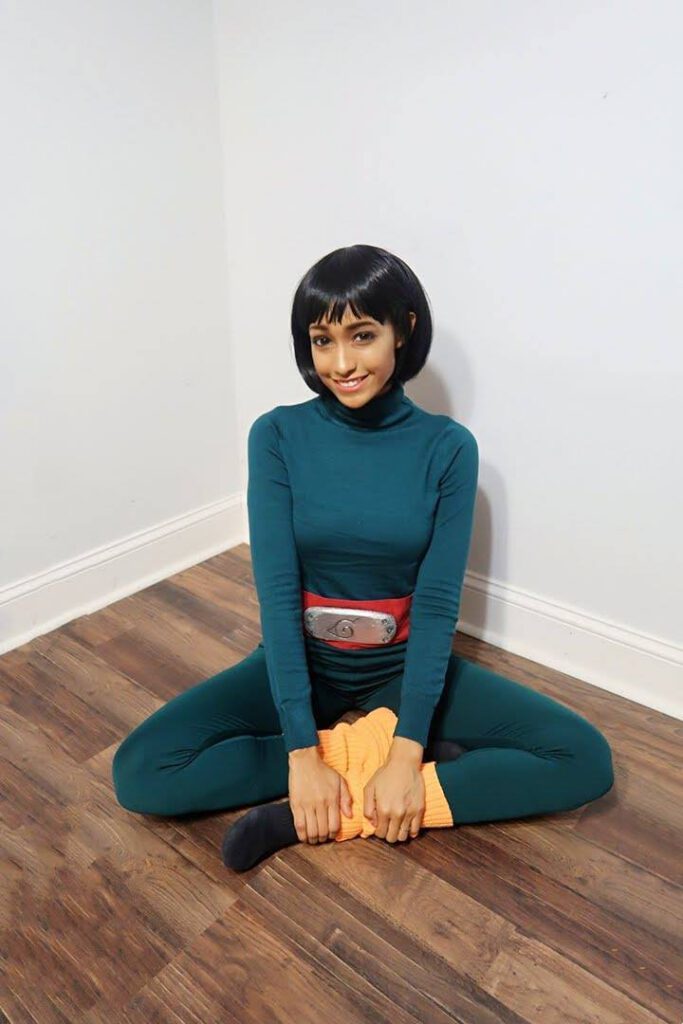 Light skin black girl smiling as rock lee