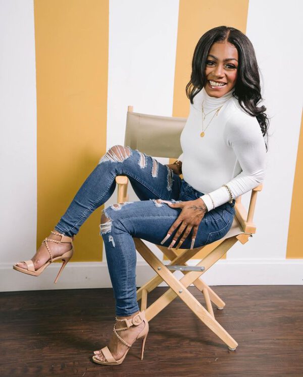 Sha Carri Richardson Wearing Torn Blue Jeans With Long Sleeve White ...