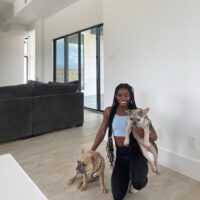 Simone Biles With Both Her Dogs