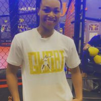 Claressa Shields smiling with shirt