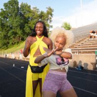 Claressa Shields with friend on track field