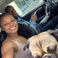 Gabby Thomas smile selfie with dog bf