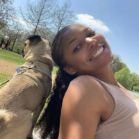 Gabby Thomas teeth with dog