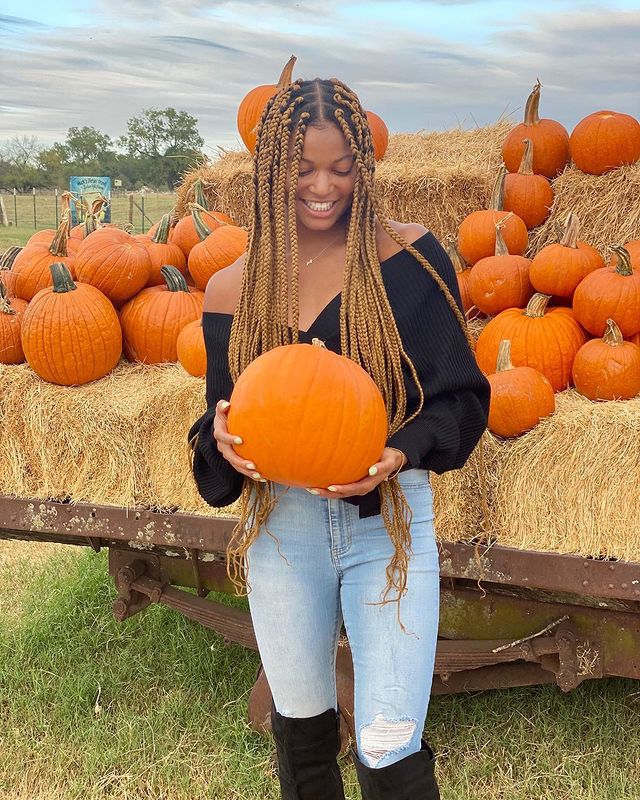 Gabby Thomas with pumpkin