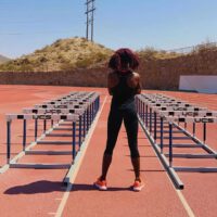 Tobi Amusan getting ready to do hurdles