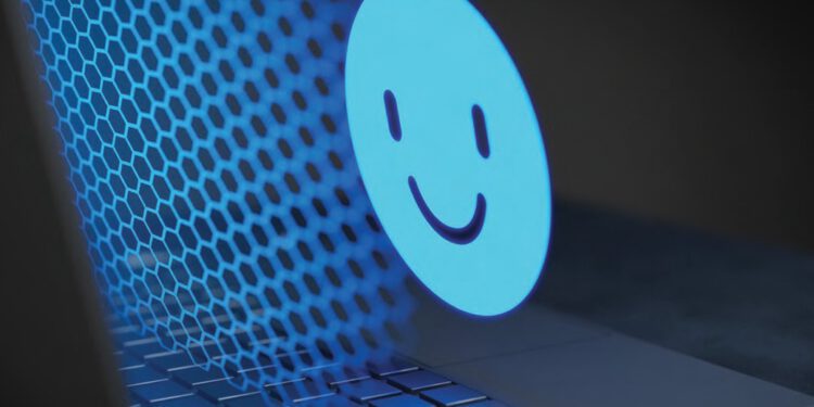 computer screen with a large happy face