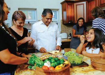 family enjoying preparing a meal together