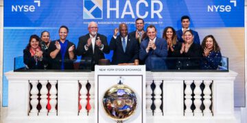 HACR staff and board members on the dais of the New York Stock Exchange on Friday, Oct. 6, 2023 during the closing ceremony.