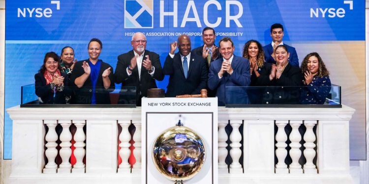 HACR staff and board members on the dais of the New York Stock Exchange on Friday, Oct. 6, 2023 during the closing ceremony.