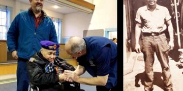 Solomon Atkinson, a pioneering Navy SEAL in wheelchair at ceremony with young self pictured on the side