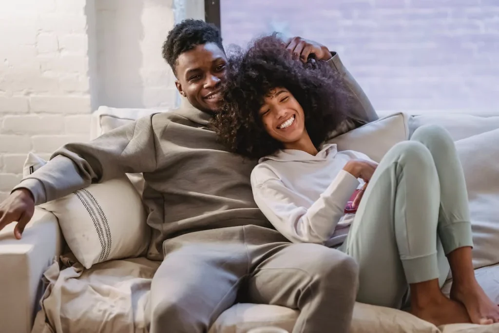 Smiling Couple Watching Tv