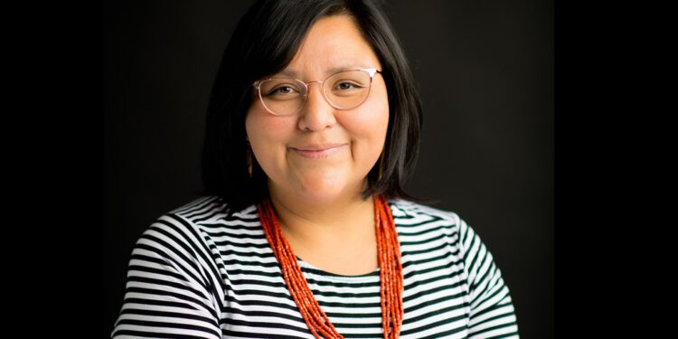 Headshot of Kelley Mitchell smiling