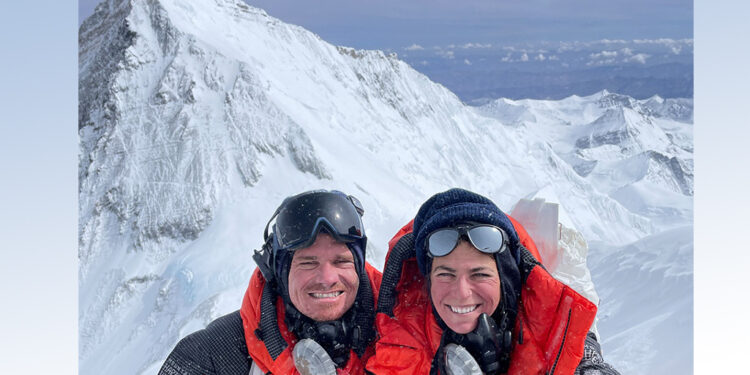 Unger and Lehmann posing on mountain in climbing gear smiling