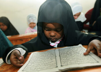 Black Child Reading Quran