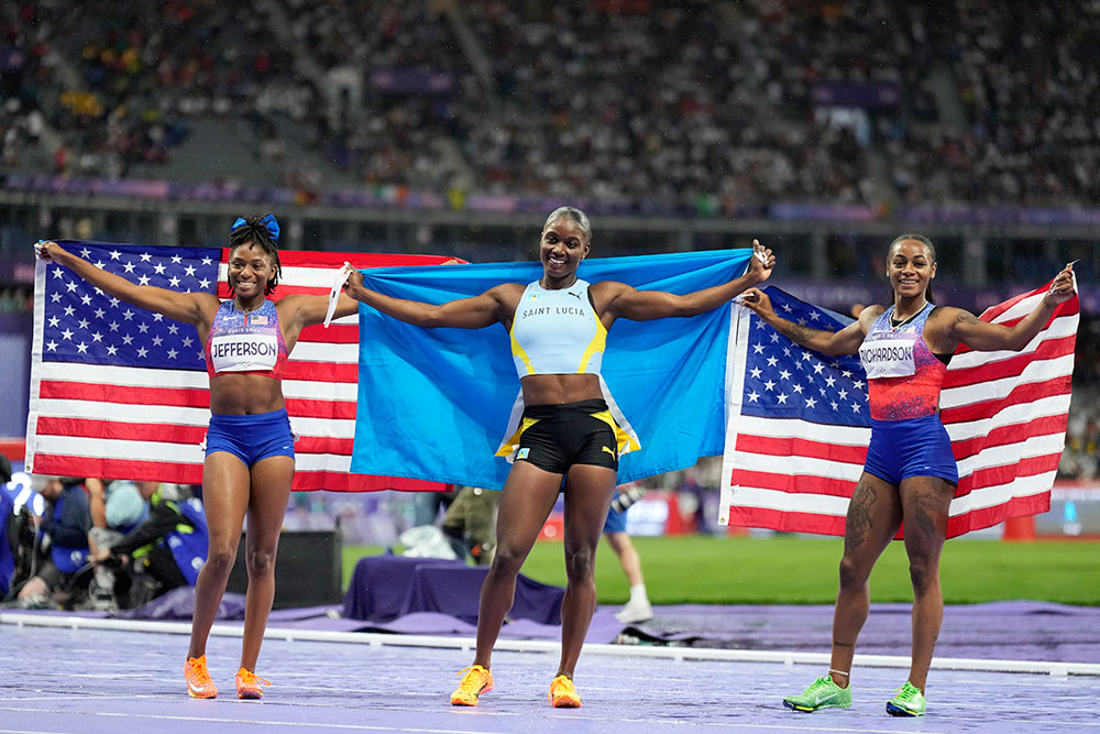 Julien Alfred Posing With Gold Medal